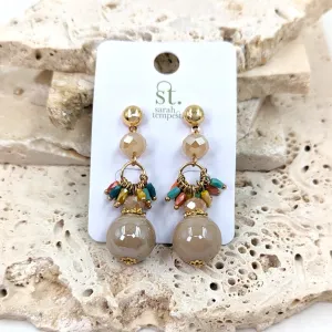 Dangle earrings with round bead and other small beads